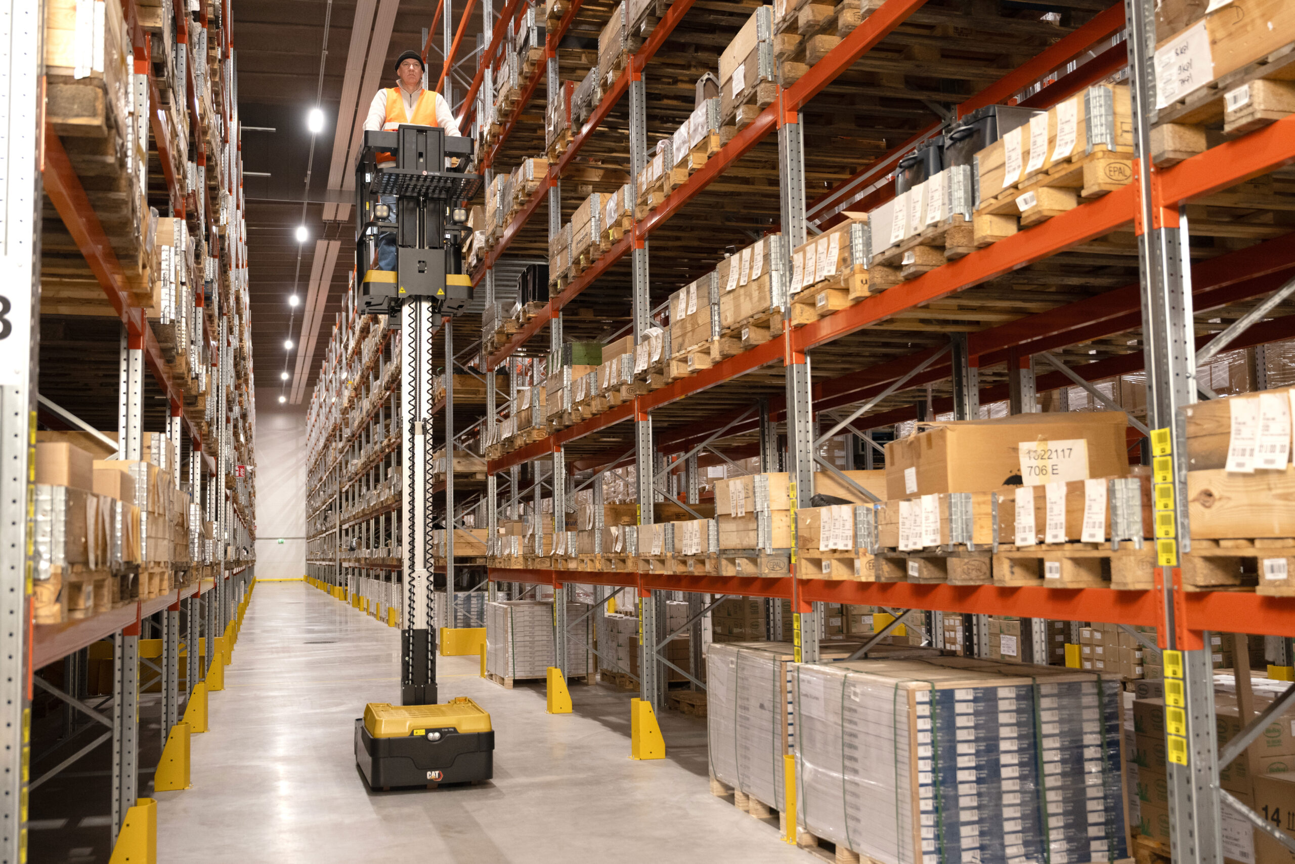 Cat Mini Order Picker at full height in a warehouse
