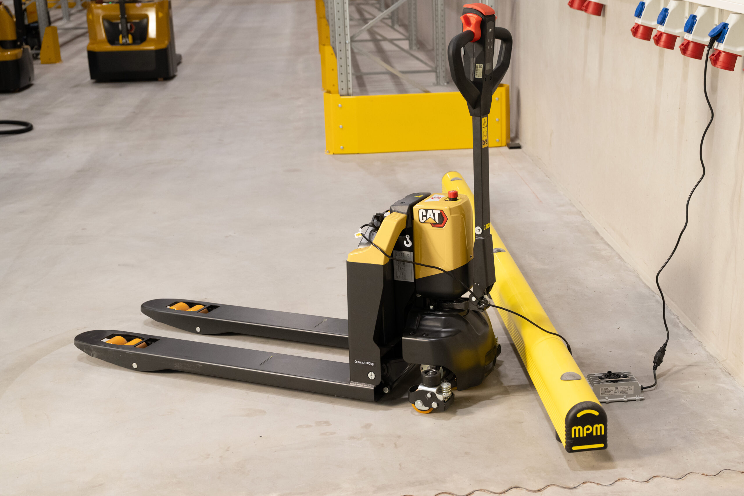 Cat Lift Trucks NPP15QBL lithium pallet truck being charged in a warehouse